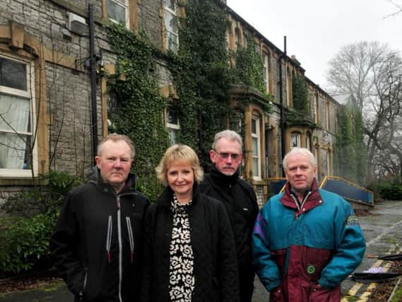 Members of Clitheroe Civic Society protest against the demolition of the former Clitheroe Hospital building. They are, from left, Duncan and Ruth Thompson, Steve Burke and Len Middleton.