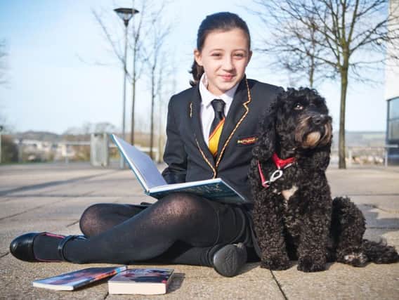 Shuttleworth College's pet pooch Jessie with Year 7 pupil Faith Simpson