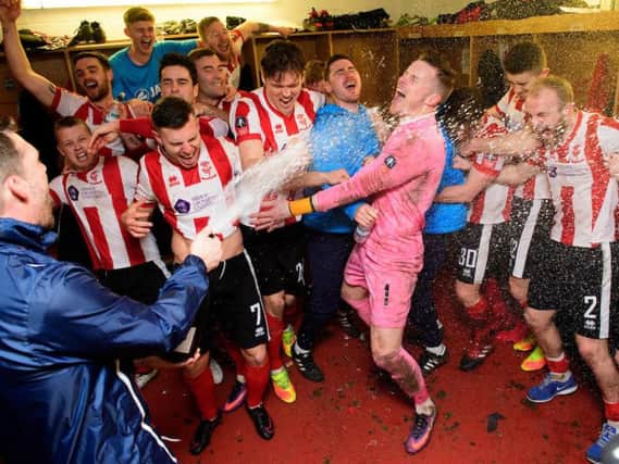 Lincoln City celebrate their fourth round victory over Championship side Brighton