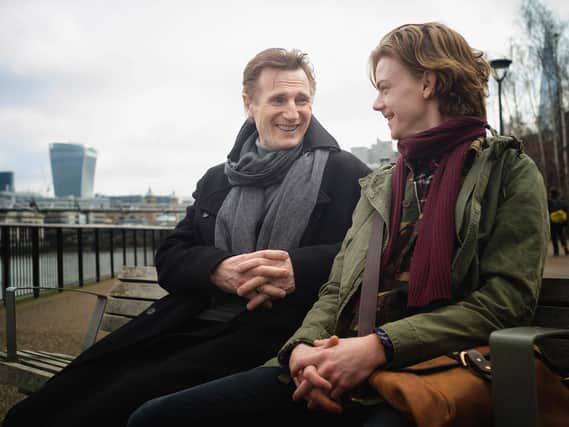Liam Neeson (left) as Daniel and Thomas Brodie - Sangster as Sam, during filming for 'Red Nose Day Actually'