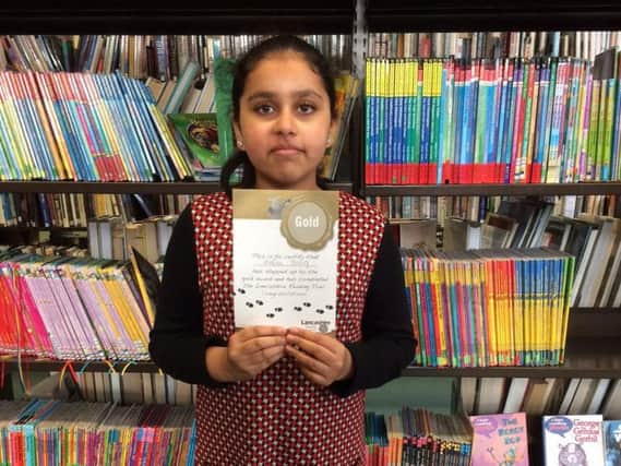 Young reader Hafsa Baig who is goinfg for her third gold award in the Lancashire Reading Trail scheme
