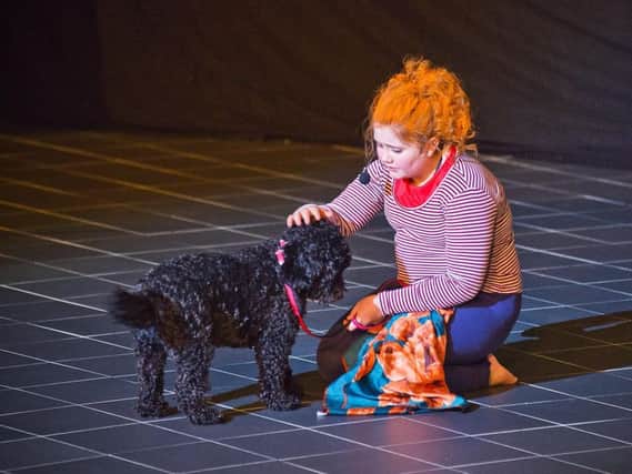 Emily Clarkson as Annie with Jessie the dog in the Shuttleworth College production of the timeless musical