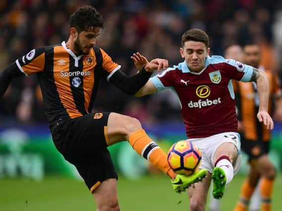 Robbie Brady challenges for the ball