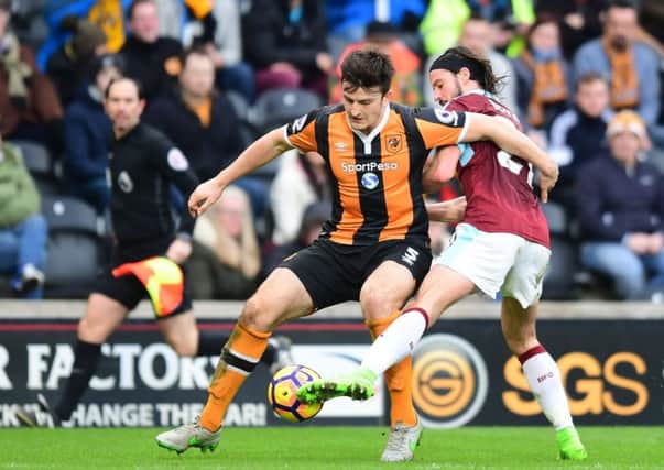 Hull City's Harry Maguire shields the ball from Burnley's George BoydPhotographer Chris Vaughan/CameraSportThe Premier League - Hull City v Burnley - Saturday 25th February 2017 -  KCOM Stadium - HullWorld Copyright Â© 2017 CameraSport. All rights reserved. 43 Linden Ave. Countesthorpe. Leicester. England. LE8 5PG - Tel: +44 (0) 116 277 4147 - admin@camerasport.com - www.camerasport.com