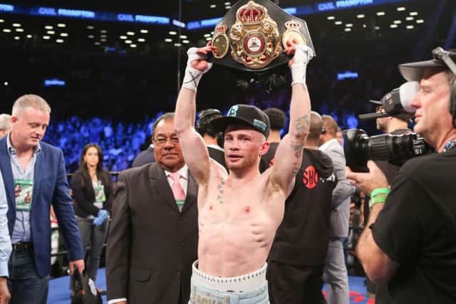 Carl Frampton shows off his belt after the first fight with Leo Santa Cruz