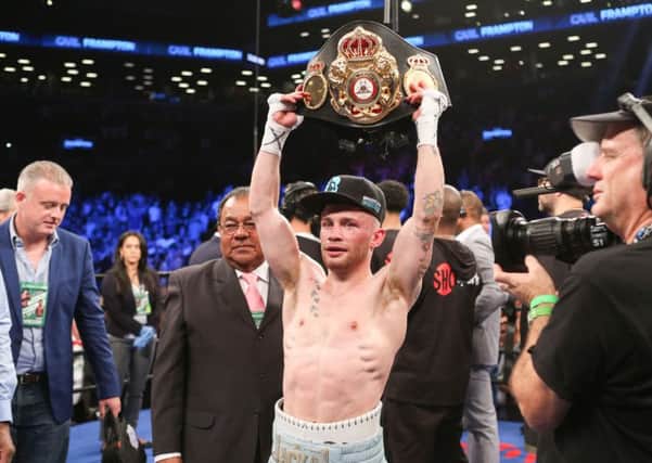 Carl Frampton shows off his belt after the first fight with Leo Santa Cruz