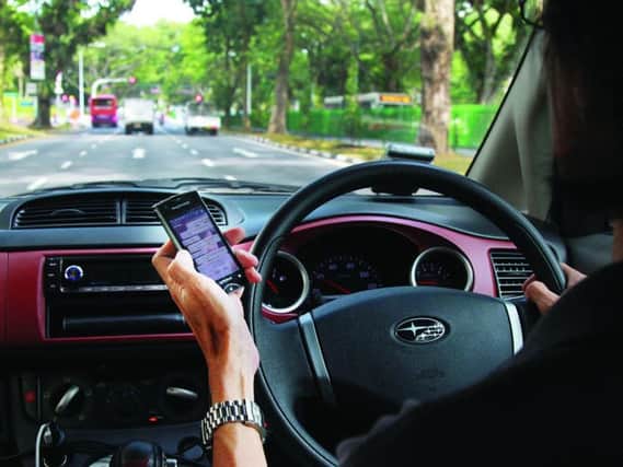 Driving whilst using your mobile is illegal