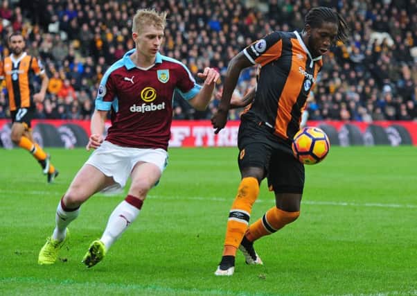 Hull City's Dieumerci Mbokani shields the ball from Burnley's Ben Mee

Photographer Andrew Vaughan/CameraSport

The Premier League - Hull City v Burnley - Saturday 25th February 2017 -  KCOM Stadium - Hull

World Copyright Â© 2017 CameraSport. All rights reserved. 43 Linden Ave. Countesthorpe. Leicester. England. LE8 5PG - Tel: +44 (0) 116 277 4147 - admin@camerasport.com - www.camerasport.com