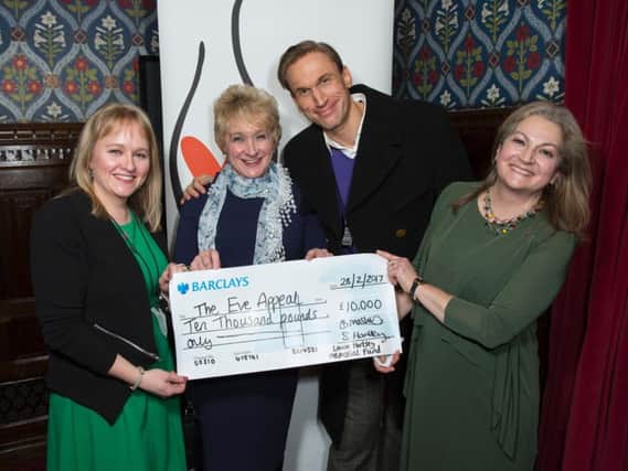 Sarah Hartley and Bridget Mashiter presenting their cheque to The Eve Appeal at the Houses of Parliament. (s)