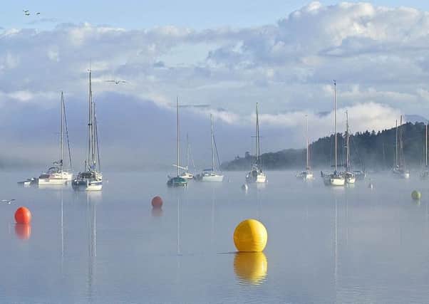 A misty view of Lake Windemere from Waterhead