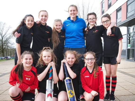 Abi Bates, who has won the Lancashire Young Cricket Coach of the Year Award, with some of her students and cricketers at Shuttleworth College.