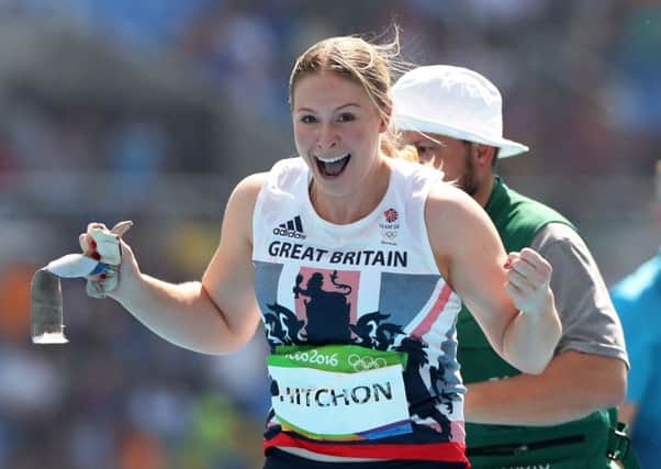 Britain's Sophie Hitchon celebrates after winning the bronze medal in the women's hammer throw final during the athletics competitions of the 2016 Summer Olympics at the Olympic stadium in Rio de Janeiro, Brazil, Monday, Aug. 15, 2016. (AP Photo/Lee Jin-man)