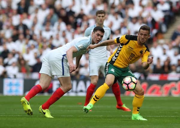 England's Michael Keane and Lithuania's Nerijus Valskis battle for the ball during the World Cup Qualifying match at Wembley Stadium, London. PRESS ASSOCIATION Photo. Picture date: Sunday March 26, 2017. See PA story SOCCER England. Photo credit should read: Nick Potts/PA Wire. RESTRICTIONS: Use subject to FA restrictions. Editorial use only. Commercial use only with prior written consent of the FA. No editing except cropping.