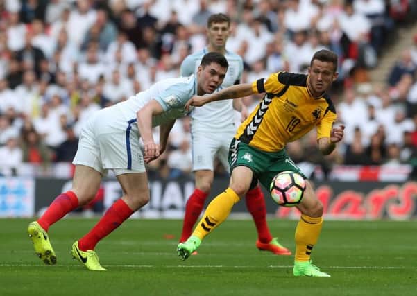 England's Michael Keane and Lithuania's Nerijus Valskis battle for the ball during the World Cup Qualifying match at Wembley Stadium, London. PRESS ASSOCIATION Photo. Picture date: Sunday March 26, 2017. See PA story SOCCER England. Photo credit should read: Nick Potts/PA Wire. RESTRICTIONS: Use subject to FA restrictions. Editorial use only. Commercial use only with prior written consent of the FA. No editing except cropping.