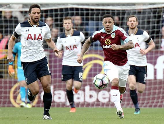 Andre Gray bursts away from Moussa Dembele