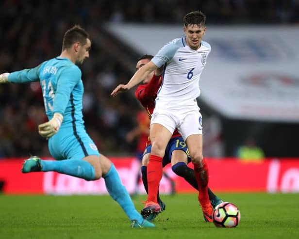 England's John Stones (right) holds of Spain's Iago Aspas (behind) as England goalkeeper Tom Heaton clears the ball during the International Friendly at Wembley Stadium, London. PRESS ASSOCIATION Photo. Picture date: Tuesday November 15, 2016. See PA story SOCCER England. Photo credit should read: Nick Potts/PA Wire. RESTRICTIONS: Use subject to FA restrictions. Editorial use only. Commercial use only with prior written consent of the FA. No editing except cropping.