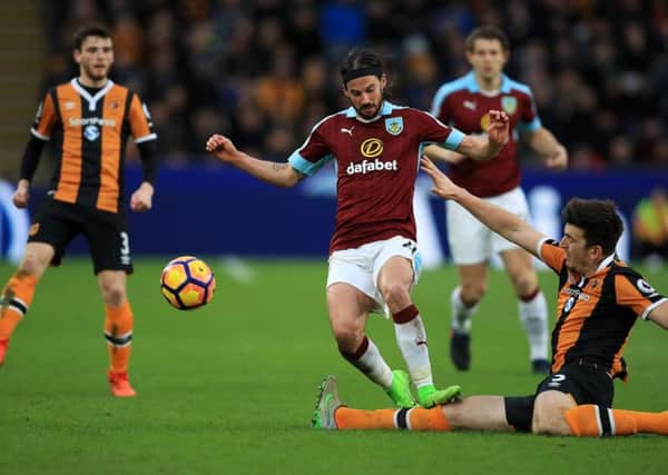 Burnley's George Boyd (centre) and Hull City's Harry Maguire battle for the ball during the Premier League match at the KCOM Stadium, Hull. PRESS ASSOCIATION Photo. Picture date: Saturday February 25, 2017. See PA story SOCCER Hull. Photo credit should read: Mike Egerton/PA Wire. RESTRICTIONS: EDITORIAL USE ONLY No use with unauthorised audio, video, data, fixture lists, club/league logos or "live" services. Online in-match use limited to 75 images, no video emulation. No use in betting, games or single club/league/player publications.