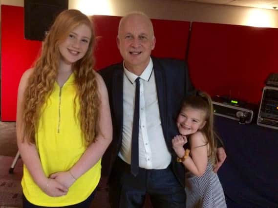 Sixties pop star Mike Quinn with junior church queen Estelle Pollard-Cox (left) and his granddaughter, Paige, after the fund raising night he performed at in Burnley