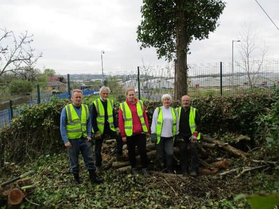 Martholme Greenway volunteers get stuck into the project. They are (from left to right)  Dr. John Barker,  Bob Anderson, Mary Hargreaves-Barker, Cath Clarkson and Chris Clarkson.