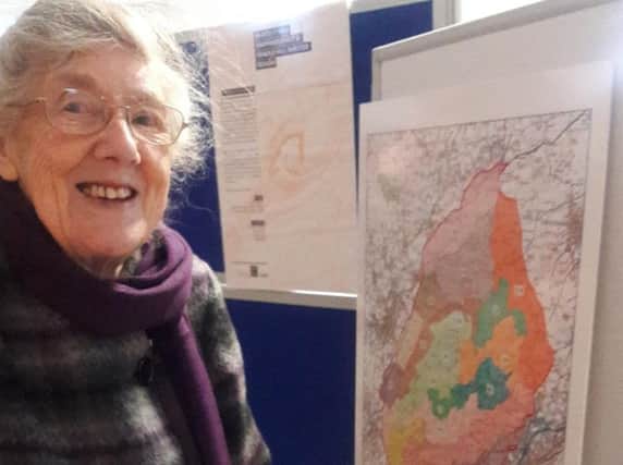 Pendle resident Miss Foster looks at some of the exicting plans on the map for Pendle Hill.