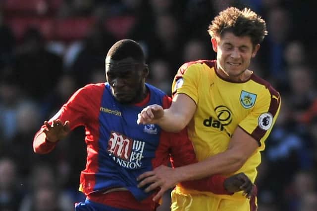 James Tarkowski battles for possession with Crystal Palace's Christian Benteke