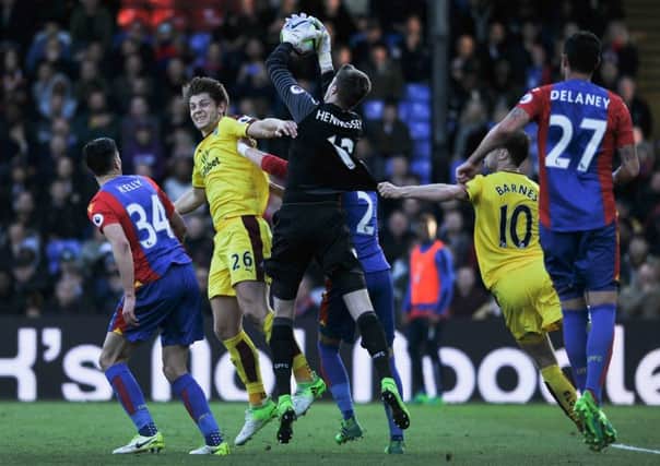 Crystal Palace's Wayne Hennessey battles for possession with James Tarkowski
