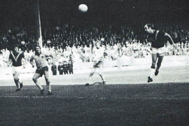 Peter Noble heads home the first of four goals he scored against Norwich City