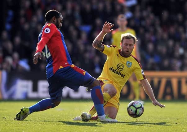Scott Arfield battles for possession with Crystal Palace's Jason Puncheon