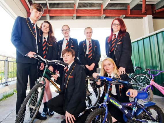 Shuttleworth Community College students Chelsea Carmen, Caitlan Nelson, Roger Norman, Miles Preston, Sarah Birbeck, Phoenix Sayers get ready to tinker with bikes as part of a pilot project to encourage more young people into engineering.
