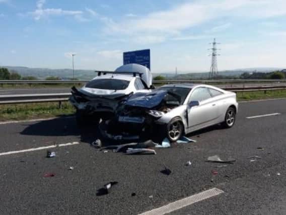 There are long delays on the M65 after a two-car crash blocked lanes on the westbound carriageway, say Highways England.