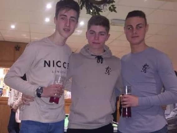 Tragic teen Oliver McIvor (centre) with his cousins Brandon (left) and Bobby Carter who are organising a charity football day in his memory.