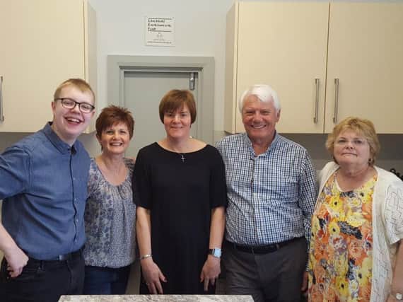 All smiles from the fund raising committee at Burnley's Sion Baptist Church at the re-opening of their new kitchen.