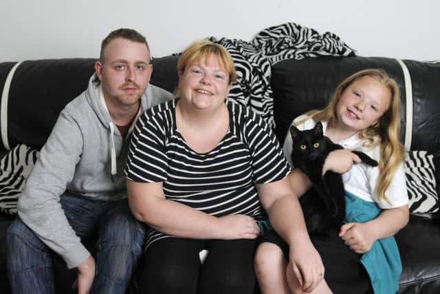 Can you help raise funds cancer sufferer Sarah Reed, pictured here with her husband Lee and daughter Chloe?