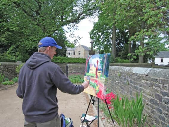 One of the artists at work at the Painting Padiham competition.