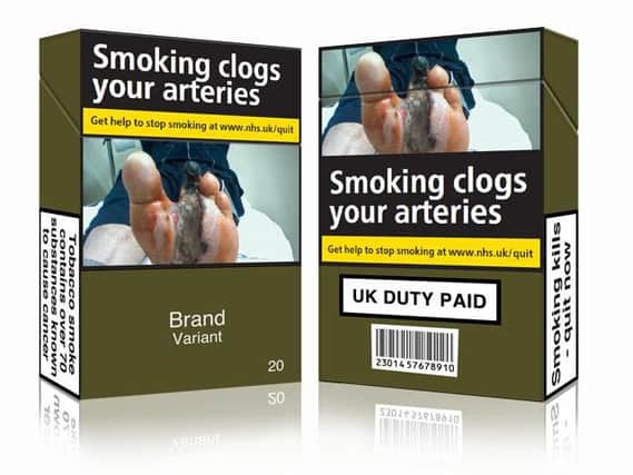 The standardised green packets aim to discourage young people from ever taking up smoking.