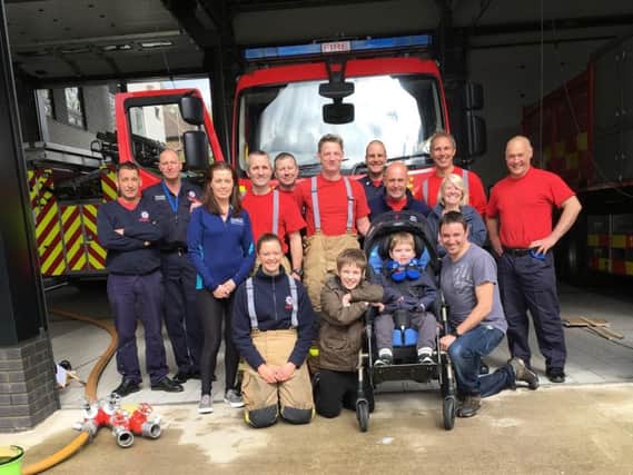 Burnley firefighters hosted a charity car wash. (s)