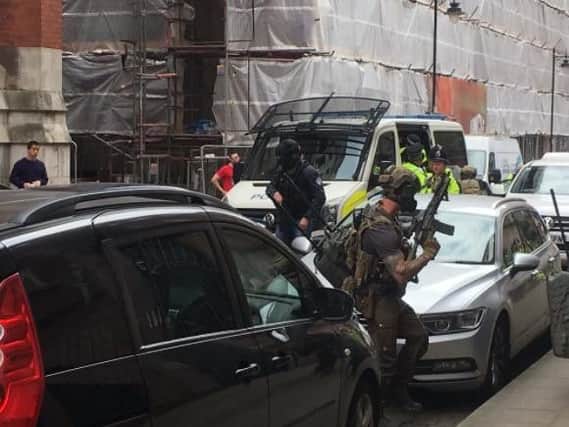 Passersby reported six vehicles with armed and military officers conducting the raid on Granby Row Pic: Louise Bolotin, journalist.