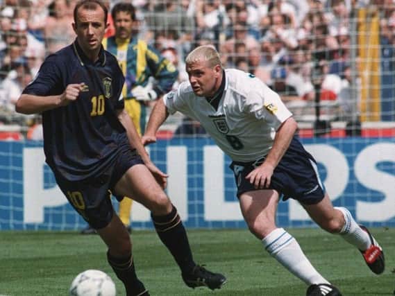 Scotland captain Gary McAllister (L) turns away from England's Paul Gascoigne, during their Euro 96 European Championship