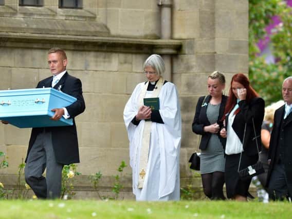 Ryan Young at Sunderland Minster, carrying the coffin of his son Reggie Richardson who was mauled to death by the family's terrier