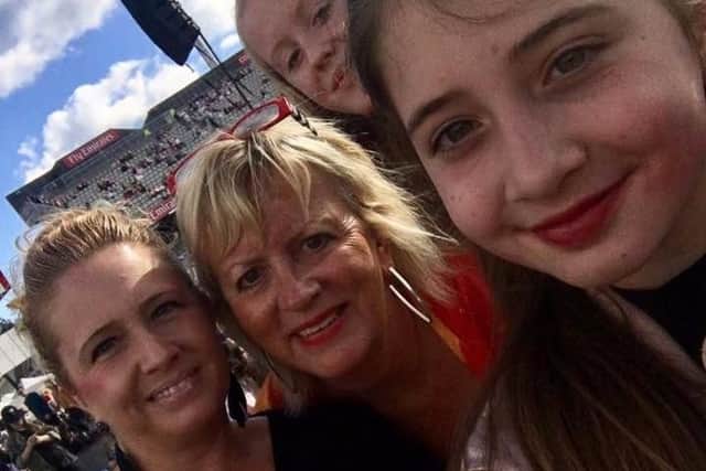 Rachel Dand (left) at the I Love Manchester concert with her daughter Leah (front) and her pal, Bella Whittaker with her mum, Mary Potter.