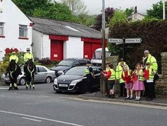 Sabden Primary School pupils armed with their laser device to catch motorists driving fast