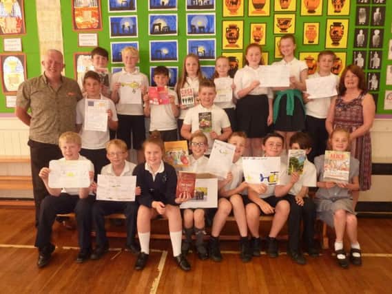 Read Rotakids with members of Padiham Rotary Club Dave Alexander and Heather Whittam
