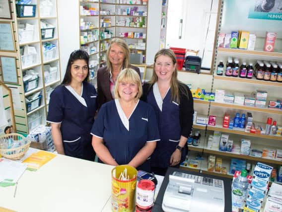 Carole Livesey (centre) celebrates 40 years of service in the same business with her colleagues (left to right) dispensing technician Majma Zahoor, pharmacist Linda Davies and pharmacy technician Sharon Pruskin