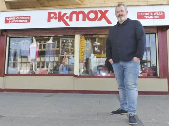 Retail giant T K Maxx has said the name of Mark Yates' store, P K Max, is too similar. Credit: SWNS