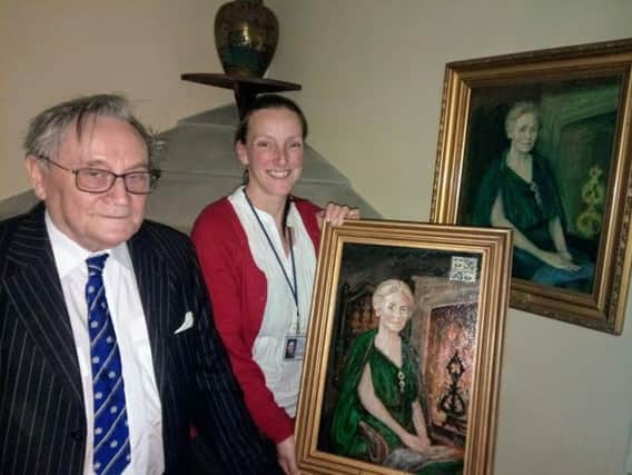 Peter Leyden and Rachel Pollitt with the old and new portraits of Rachel Kay-Shuttleworth
