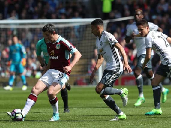 Joey Barton in action for the Clarets in his final appearance against Manchester United at Turf Moor