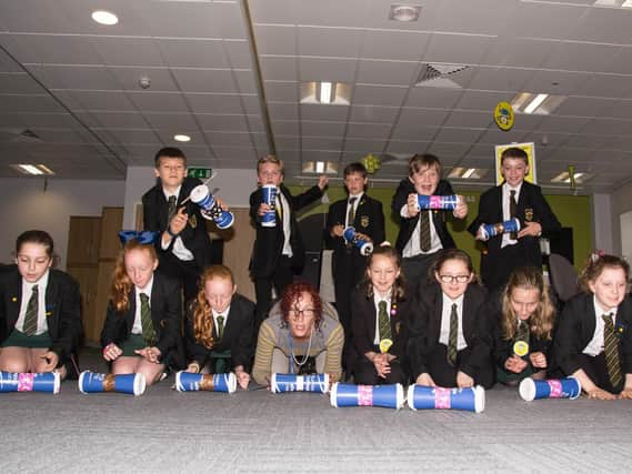 Students from Colne's Park High School try their hand at a gravity rolling competition.