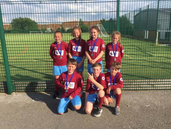 The sporting netball team from Holy Trinity Primary School who are (back row)
Abbie-Leigh McIvor, Isabel Curry, Abby Lawless, Kady Thompson, Archie McIvor with (front row) Dexta Thompson and Taylor Knowles.