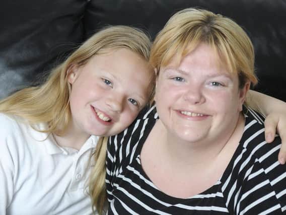 Brave mum and cancer victim Sarah Reed, who has inspired a community to raise thousands of pounds to pay for lifesaving treatment for her with her daughter Chloe
