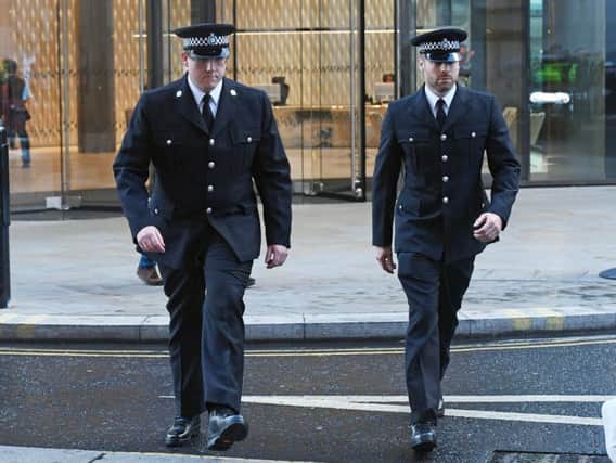 Witnesses PC Craig Nicholls (left) and PC Jonathan Wright arrive at the Old Bailey in London for the trial of Thomas Mair